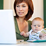 Mom with baby at computer